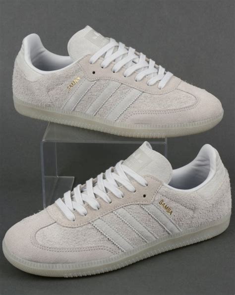 white suede Adidas trainers